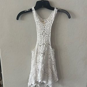 Crochet high neck tank top with flowy bottom hem
